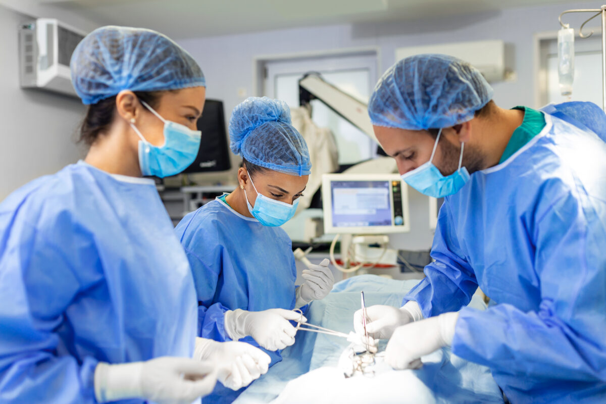 Team of neurosurgeons performing brain surgery in a modern hospital operating room in India