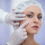 Cosmetic surgeon examining female patient’s face during consultation at top hospital in India