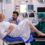 Doctor assisting pregnant woman during childbirth with partner support at leading IVF hospital in India