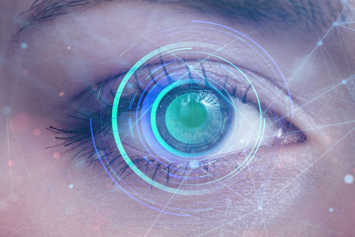 Close-up of a human eye with futuristic digital graphics, symbolizing advanced technology and precision in LASIK Vision Correction Surgery India.