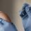 Close-up of a healthcare professional wearing blue gloves preparing to administer a vaccine injection into a patient’s arm, representing the HPV Vaccine in India.
